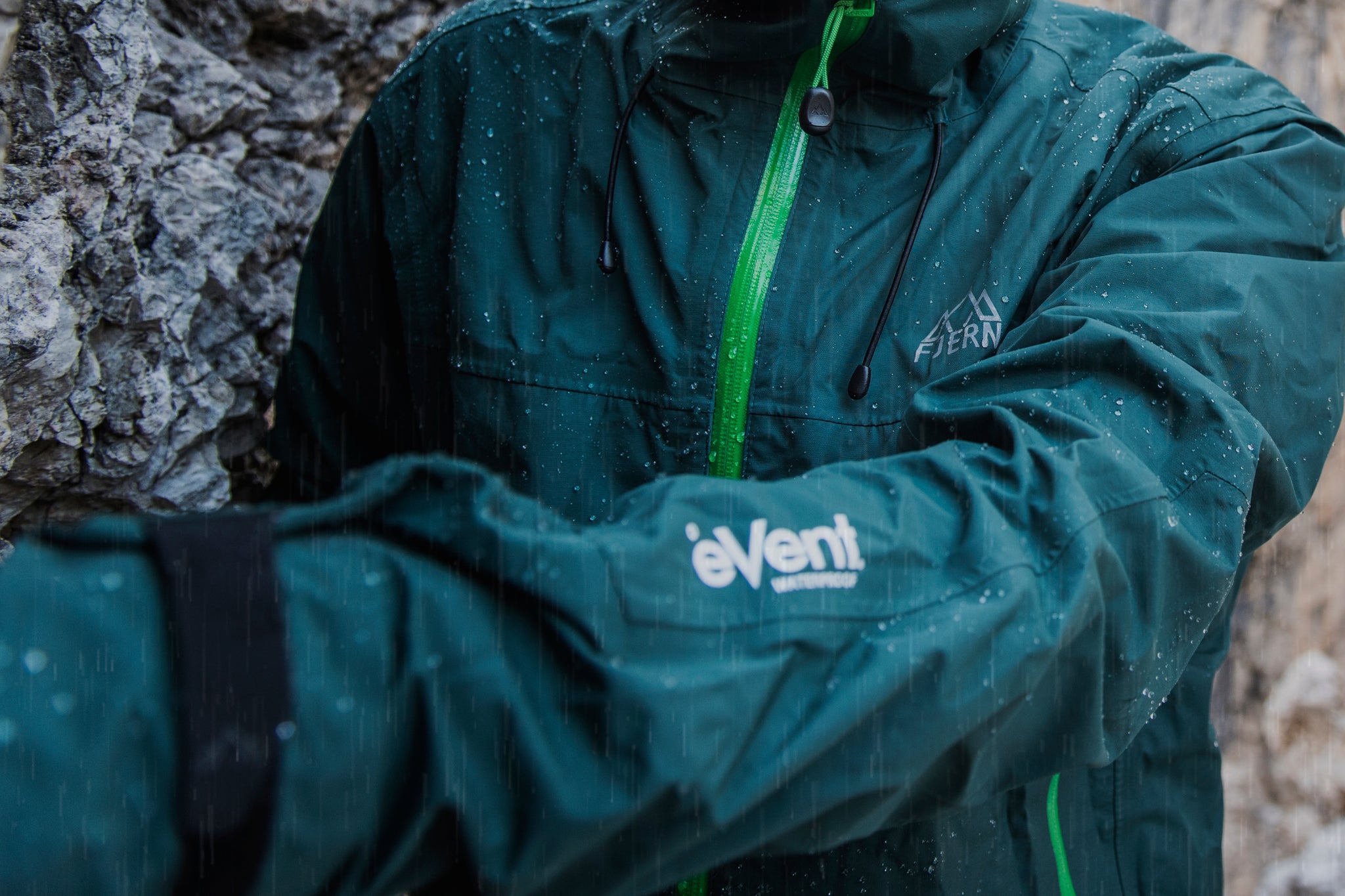 eVent jacket close-up with Fjern logo in rain