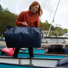 Fjern - Fördra 70L Duffle Bag (Midnight) | Made from durable 100% recycled polyester with a TPU-film laminate, the Fördra duffle bag offers 70L of storage, multiple pockets, and versatile carrying options